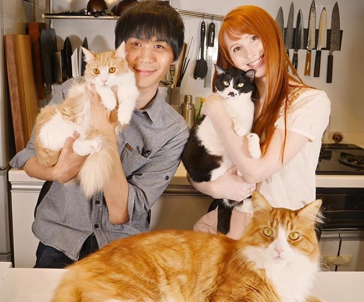 Jun and Rachel with their cats.